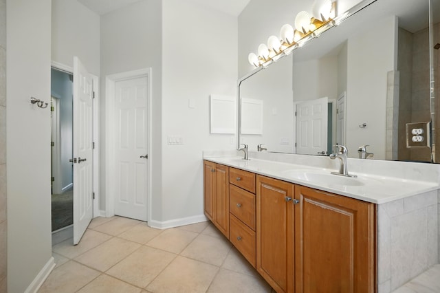 500 Seagate Ln, Saint Augustine, FL 32084 - full bathroom with double vanity, tile patterned flooring, and baseboards