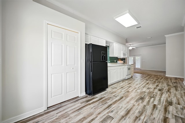 500 Seagate Ln, Saint Augustine, FL 32084 - kitchen featuring white appliances, ornamental molding, light wood-style flooring, white cabinetry, and backsplash