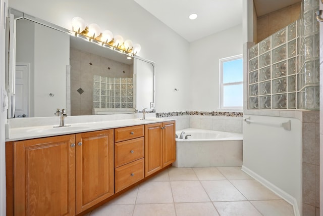 500 Seagate Ln, Saint Augustine, FL 32084 - bathroom featuring double vanity, tile patterned floors, a bath, and a walk in shower