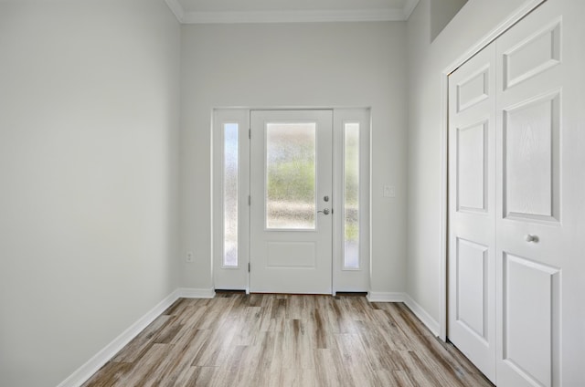 500 Seagate Ln, Saint Augustine, FL 32084 - foyer entrance with wood finished floors, ornamental molding, and baseboards