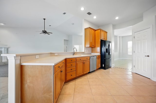 500 Seagate Ln, Saint Augustine, FL 32084 - kitchen featuring black fridge with ice dispenser, stainless steel dishwasher, a peninsula, light countertops, and a sink