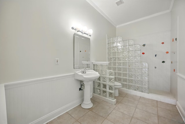 500 Seagate Ln, Saint Augustine, FL 32084 - full bathroom featuring crown molding, walk in shower, tile patterned floors, toilet, and a wainscoted wall