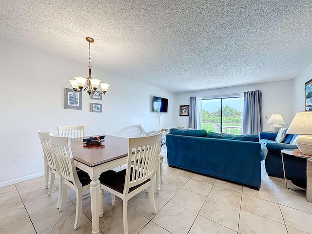 826 A1A Beach Blvd Unit 13, Saint Augustine, FL 32080 - dining space with a chandelier, a textured ceiling, and light tile patterned floors