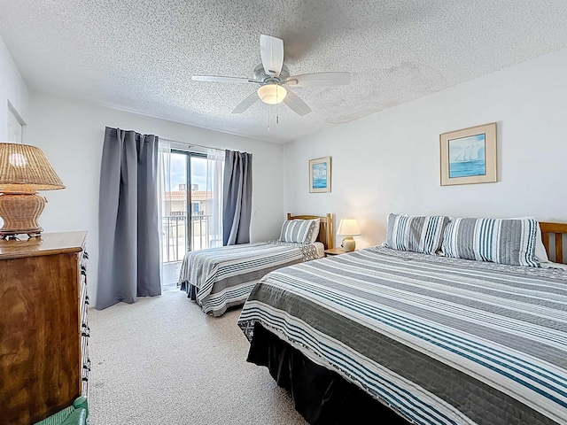 826 A1A Beach Blvd Unit 13, Saint Augustine, FL 32080 - bedroom with a textured ceiling, carpet, and ceiling fan