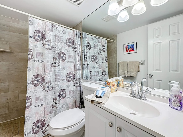 826 A1A Beach Blvd Unit 13, Saint Augustine, FL 32080 - bathroom with toilet, vanity, and tiled shower