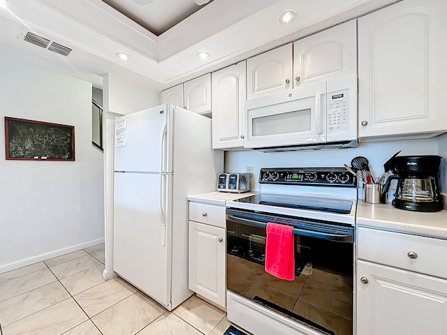 826 A1A Beach Blvd Unit 13, Saint Augustine, FL 32080 - kitchen with white appliances, light countertops, white cabinets, recessed lighting, and baseboards