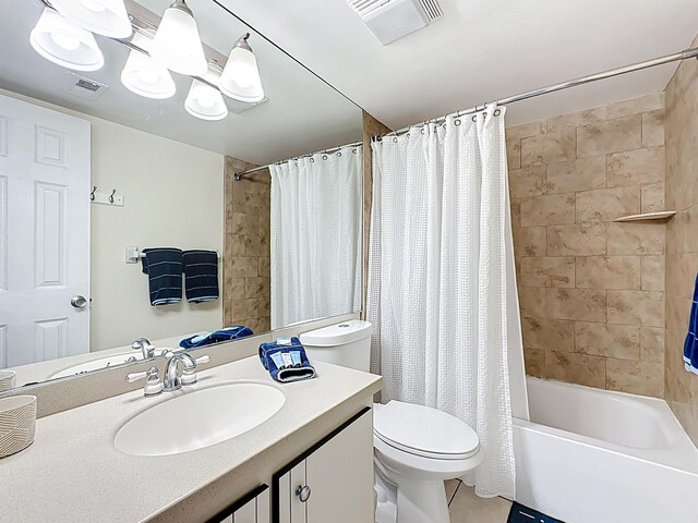 826 A1A Beach Blvd Unit 13, Saint Augustine, FL 32080 - full bathroom featuring vanity, toilet, shower / bathtub combination with curtain, and tile patterned floors
