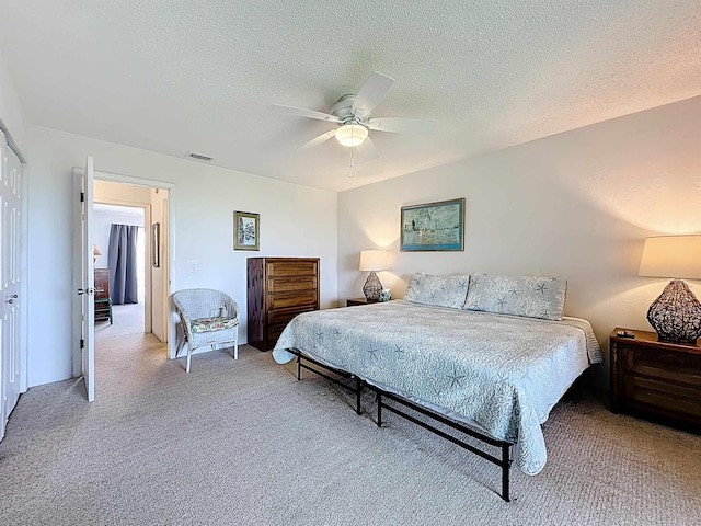 826 A1A Beach Blvd Unit 13, Saint Augustine, FL 32080 - bedroom featuring light colored carpet, a ceiling fan, and a textured ceiling