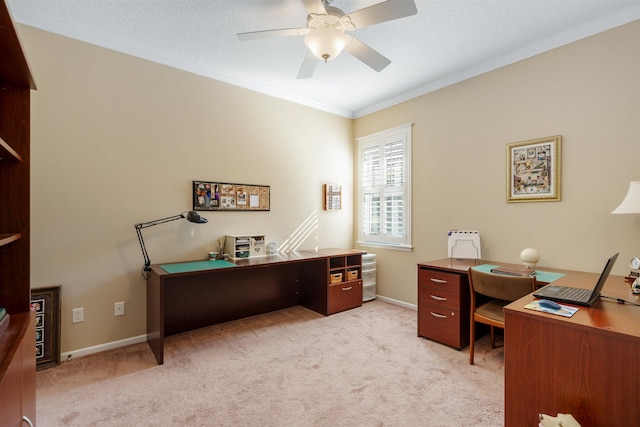 office area with ornamental molding, light carpet, ceiling fan, a textured ceiling, and baseboards