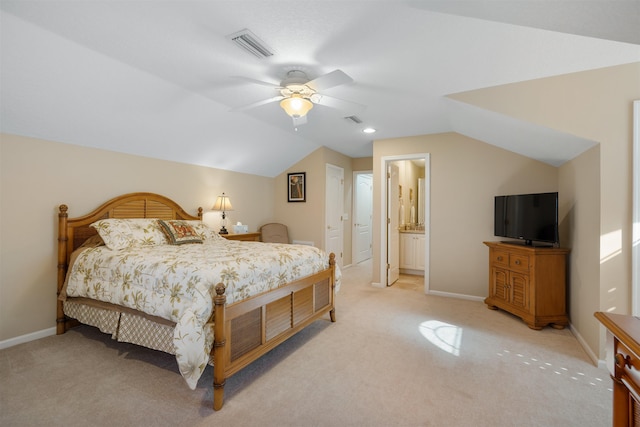 bedroom with light colored carpet, vaulted ceiling, visible vents, and baseboards