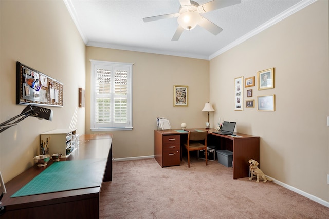 office featuring baseboards, ornamental molding, a ceiling fan, and light colored carpet