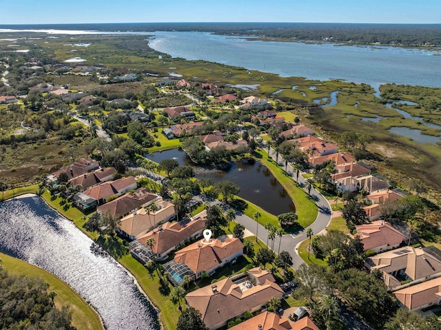 aerial view featuring a water view and a residential view