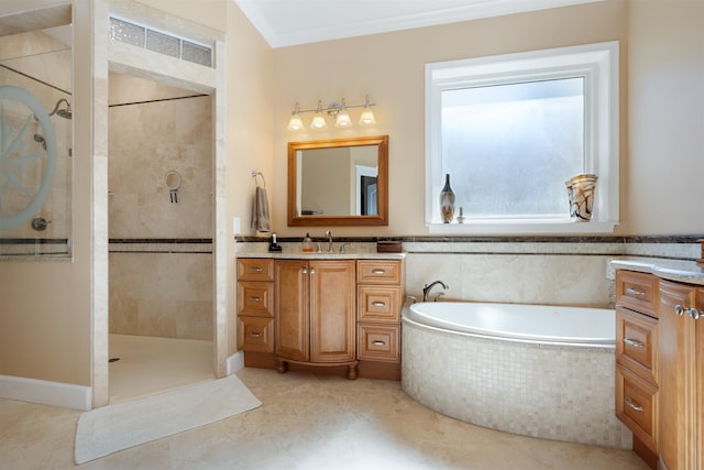 bathroom featuring a walk in shower, ornamental molding, a garden tub, and vanity