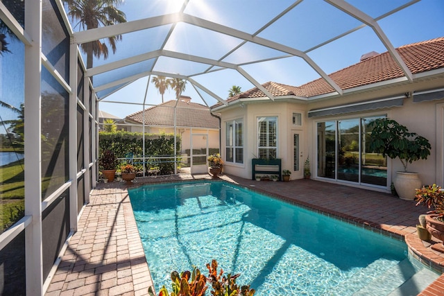 pool with a lanai and a patio