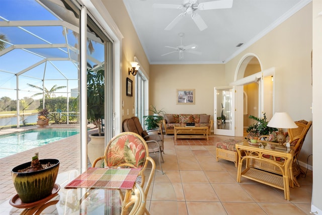 sunroom / solarium with visible vents and a ceiling fan