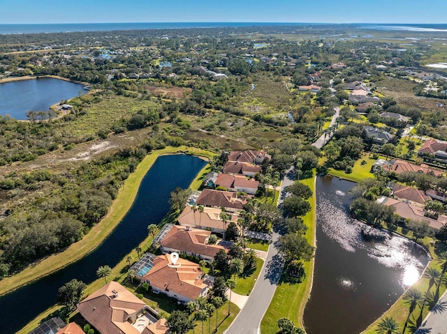 bird's eye view with a water view and a residential view