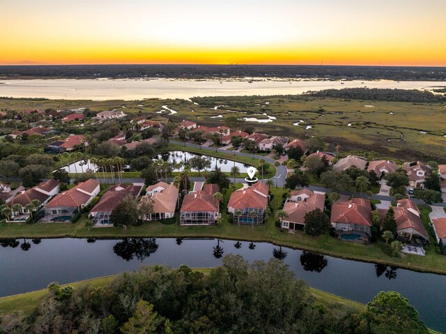 bird's eye view with a water view and a residential view