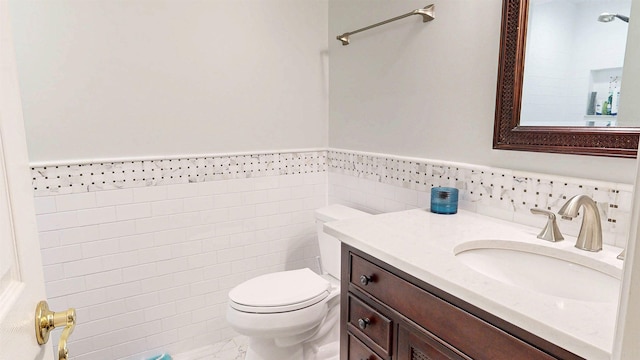 12232 Lashbrook Ct, Jacksonville, FL 32223 - half bath with toilet, vanity, tile walls, wainscoting, and marble look tiles