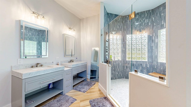12232 Lashbrook Ct, Jacksonville, FL 32223 - bathroom featuring walk in shower, vanity, and wood finished floors