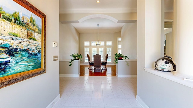 12232 Lashbrook Ct, Jacksonville, FL 32223 - corridor featuring baseboards, crown molding, arched walkways, and a chandelier
