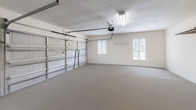 12232 Lashbrook Ct, Jacksonville, FL 32223 - garage featuring a garage door opener and baseboards