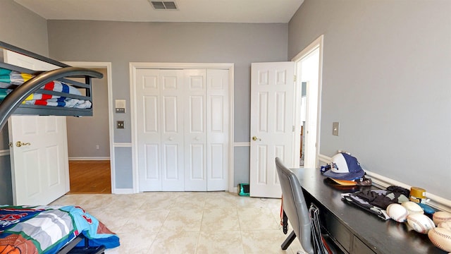 12232 Lashbrook Ct, Jacksonville, FL 32223 - bedroom with a closet, light tile patterned flooring, and a desk