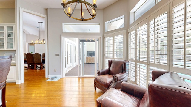 12232 Lashbrook Ct, Jacksonville, FL 32223 - sitting room with a chandelier and light wood-type flooring