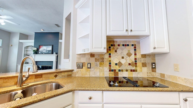 12232 Lashbrook Ct, Jacksonville, FL 32223 - kitchen with black electric cooktop, a sink, open shelves, and white cabinets