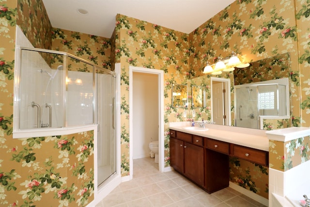 bathroom featuring tile patterned flooring, toilet, and a shower with shower door