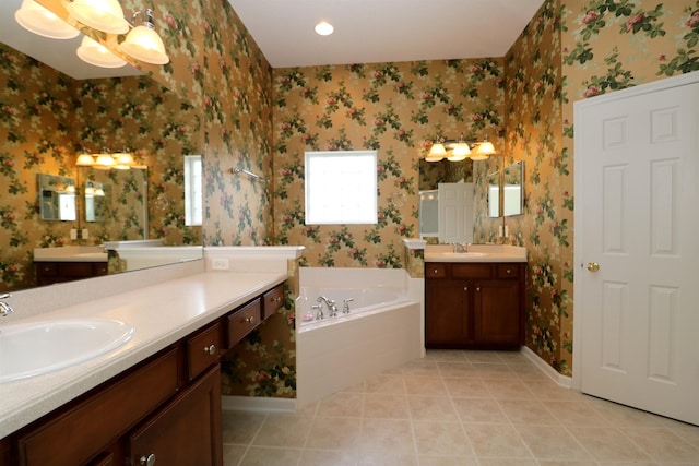 bathroom with vanity, tile patterned floors, and a bathtub