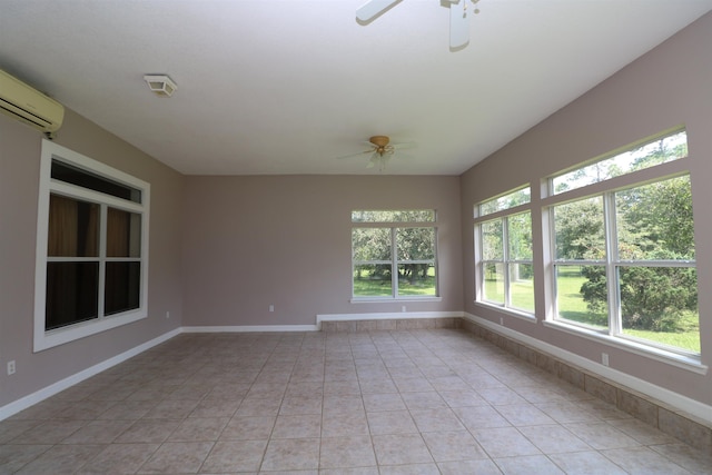 unfurnished sunroom with a wall mounted air conditioner and ceiling fan