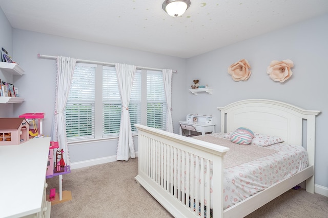 bedroom featuring light carpet