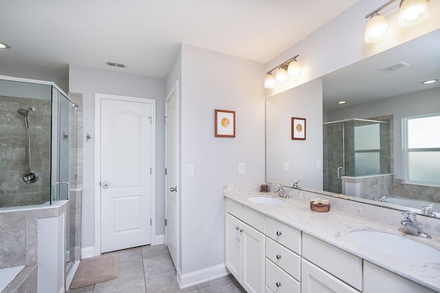 bathroom with vanity, tile patterned floors, and independent shower and bath