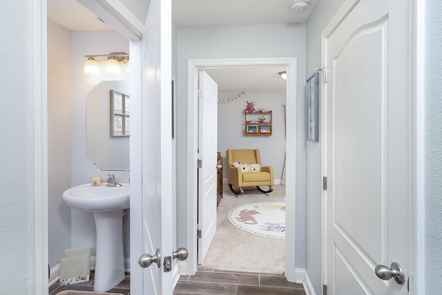 bathroom featuring wood-type flooring and sink