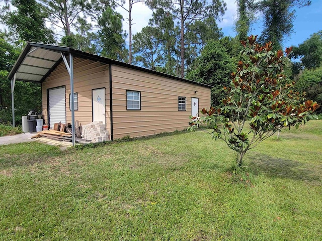 2380 Deerwood Acres Dr, Saint Augustine, FL 32084 - view of side of property featuring an outdoor structure and a lawn