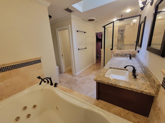2380 Deerwood Acres Dr, Saint Augustine, FL 32084 - bathroom with crown molding, a skylight, a shower stall, a whirlpool tub, and double vanity