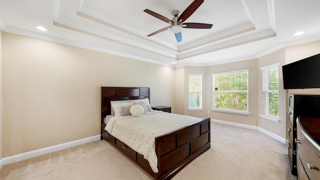 bedroom with light carpet, crown molding, a raised ceiling, and ceiling fan