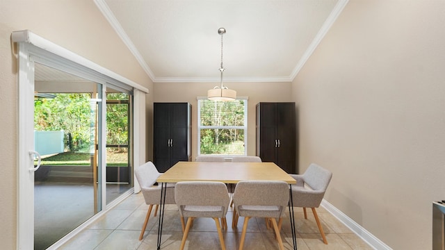 dining room featuring crown molding, lofted ceiling, and light tile patterned floors