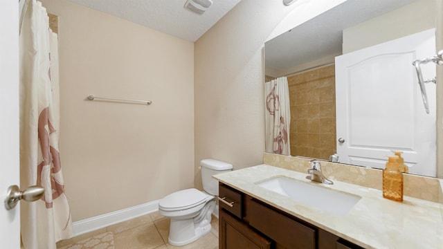 bathroom with vanity, tile patterned floors, a textured ceiling, and toilet