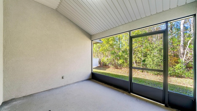 unfurnished sunroom with a healthy amount of sunlight and lofted ceiling