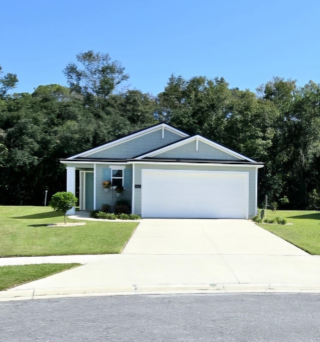 ranch-style home with a garage and a front lawn