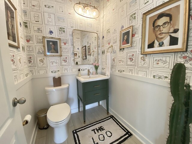 268 Sierras Loop, Saint Augustine, FL 32086 - bathroom featuring toilet, a chandelier, wallpapered walls, and vanity