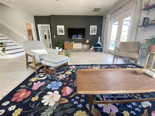 268 Sierras Loop, Saint Augustine, FL 32086 - living area featuring stairway, baseboards, and wood finished floors