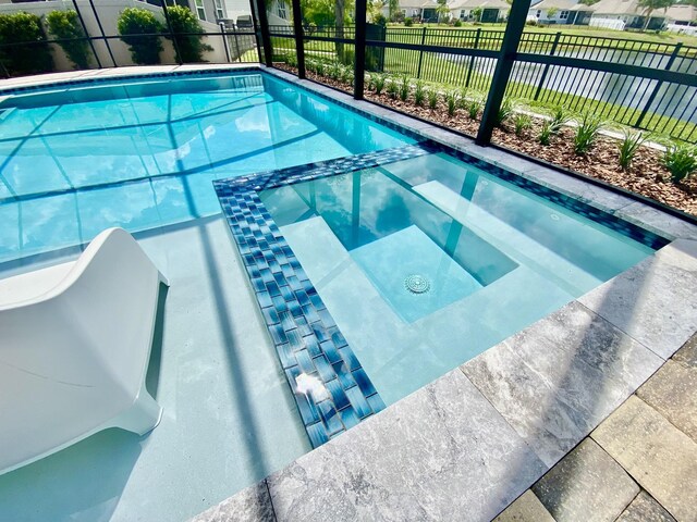 268 Sierras Loop, Saint Augustine, FL 32086 - view of pool featuring a pool with connected hot tub, fence, and a residential view
