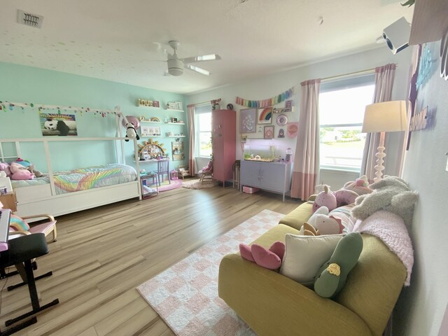 268 Sierras Loop, Saint Augustine, FL 32086 - bedroom featuring multiple windows, wood finished floors, and a ceiling fan