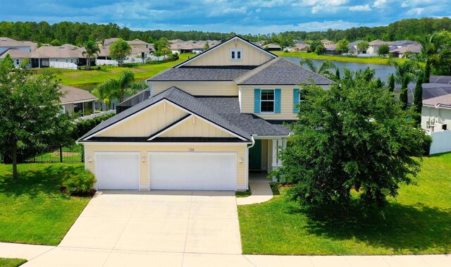 268 Sierras Loop, Saint Augustine, FL 32086 - view of front of house with board and batten siding, a residential view, a shingled roof, concrete driveway, and a garage