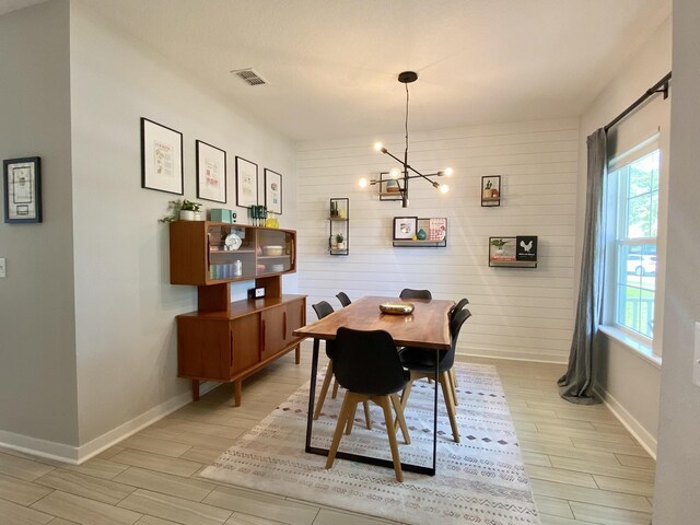 268 Sierras Loop, Saint Augustine, FL 32086 - dining area with plenty of natural light, baseboards, light wood-style flooring, and a chandelier