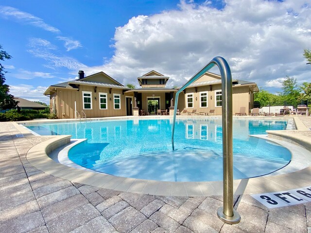 268 Sierras Loop, Saint Augustine, FL 32086 - community pool with fence and a patio