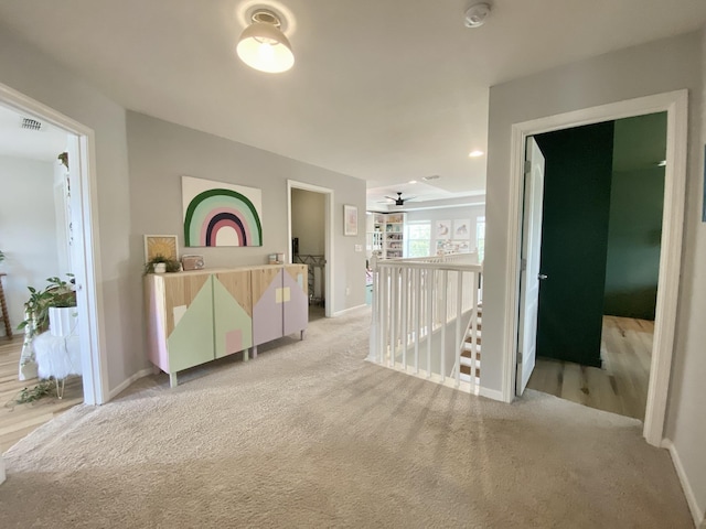 268 Sierras Loop, Saint Augustine, FL 32086 - corridor with light colored carpet, baseboards, and an upstairs landing