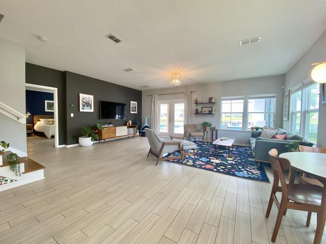 268 Sierras Loop, Saint Augustine, FL 32086 - living area with plenty of natural light, light wood-style flooring, and baseboards